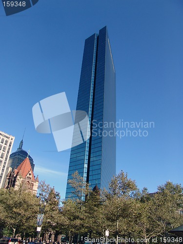 Image of John Hancock Tower rising above the trees