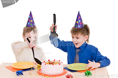 Image of two boy wich cake