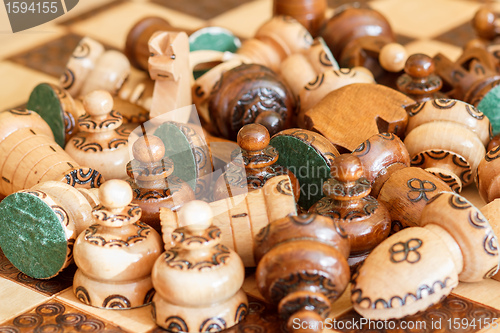Image of abandoned wooden pieces of chess