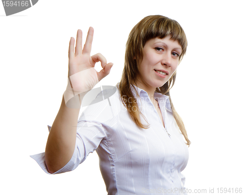 Image of Young girl shows sign ok