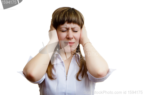 Image of young girl covers his ears with his hands