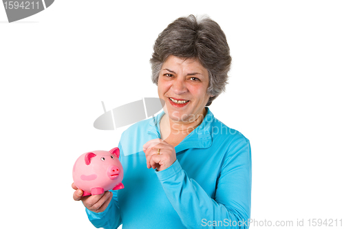 Image of Female senior with piggy bank 