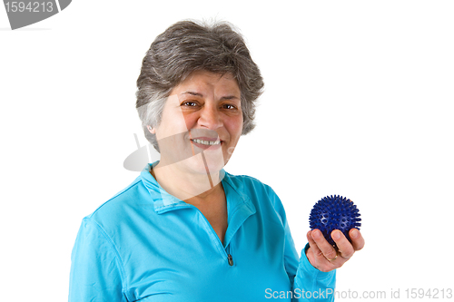 Image of Female senior holding massage ball