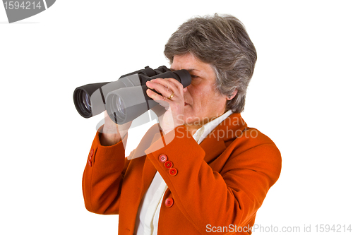 Image of Female senior business woman with binoculars