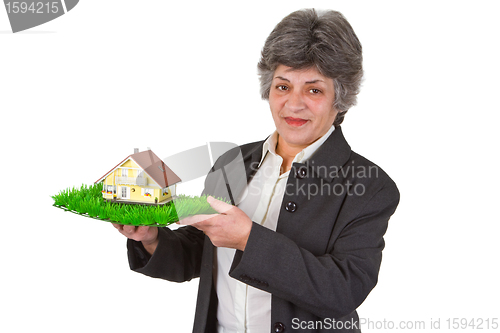 Image of Female senior with toy house