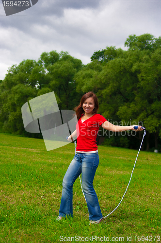 Image of Young woman with skipping rope