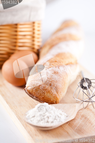 Image of  bread, flour, eggs and kitchen utensil