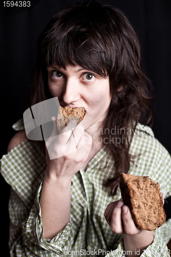 Image of beggar woman eating bread