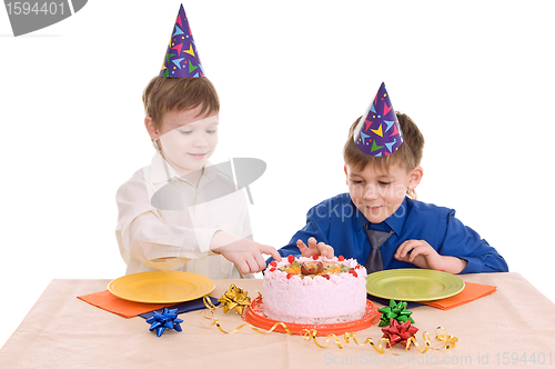 Image of two boy wich cake