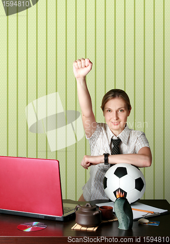 Image of businesswoman watching soccer competitions