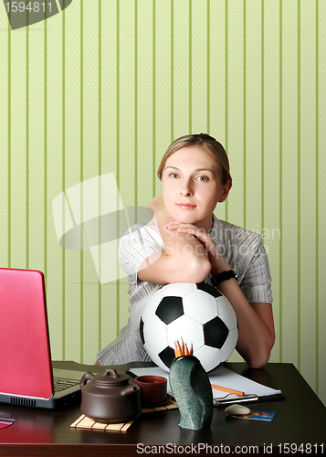 Image of businesswoman watching soccer competitions