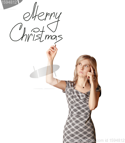 Image of businesswoman writting Merry Christmas