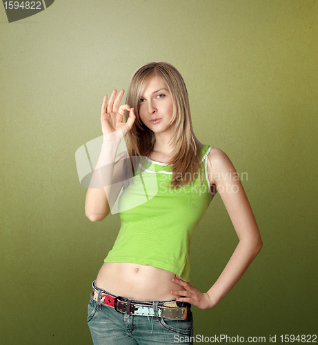 Image of cute woman says OK
