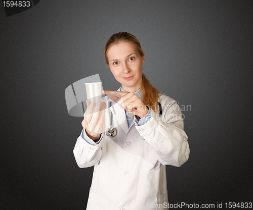 Image of doctor woman with cup for analysis