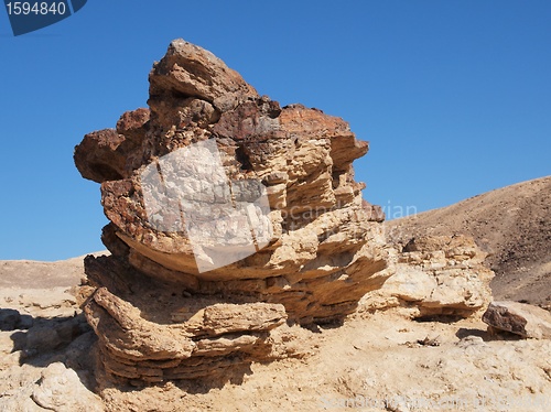 Image of Scenic stratified orange rock in stone desert