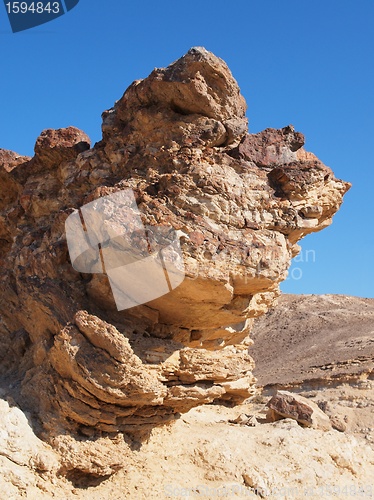 Image of Scenic stratified orange rock in stone desert