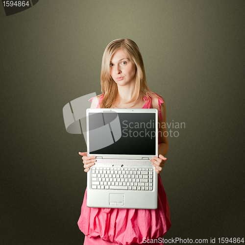 Image of femaile in pink with open laptop