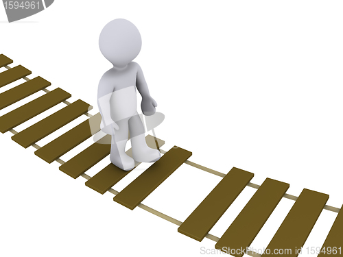 Image of Person walking on damaged bridge