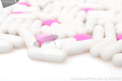 Image of Pink Pills and White Capsule