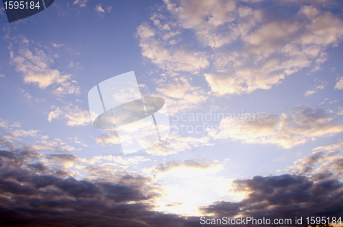 Image of Sunny morning sky full of clouds. 
