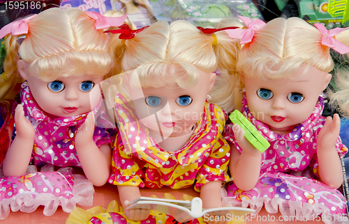 Image of Dolls trinity.