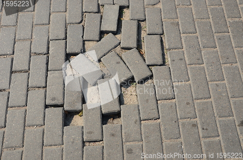 Image of Small tiled sidewalk without few ones.