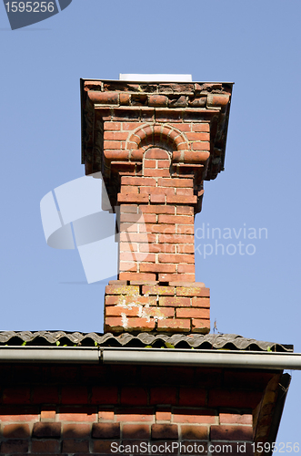 Image of Antique red brick chimney.