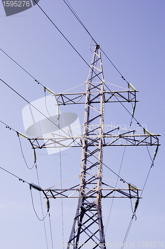Image of High voltage electricity wires and poles.