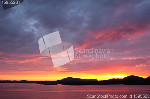 Image of sunset view from a boat off the coast of norway