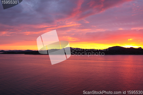 Image of sunset view from a boat off the coast of norway