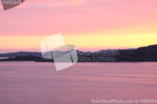 Image of sunset view from a boat off the coast of norway