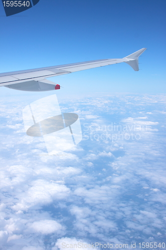 Image of clouds and blue sky seen from plane