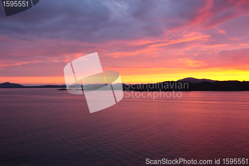 Image of sunset view from a boat off the coast of norway