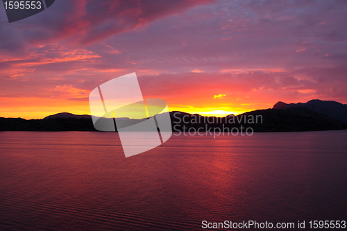 Image of sunset view from a boat off the coast of norway