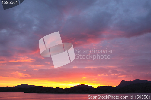 Image of sunset view from a boat off the coast of norway