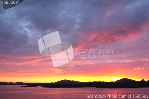 Image of sunset view from a boat off the coast of norway