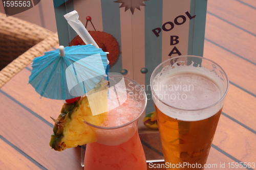 Image of glass of fruit cocktail and a glass of beer