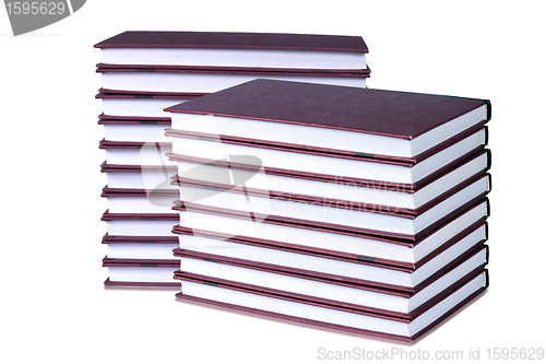 Image of Books neatly stacked on a white background