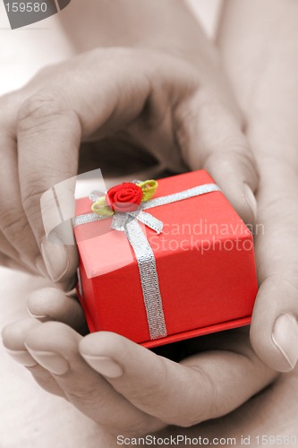 Image of Hands and Gift Sepia