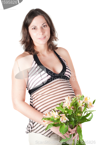 Image of Portrait of pretty pregnant woman with flowers