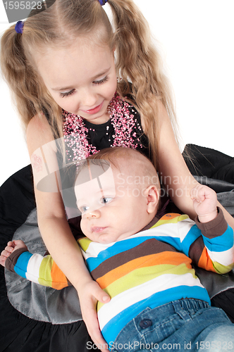 Image of Newborn baby with sister