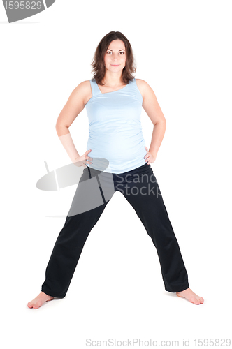 Image of Portrait of pretty pregnant woman practicing yoga