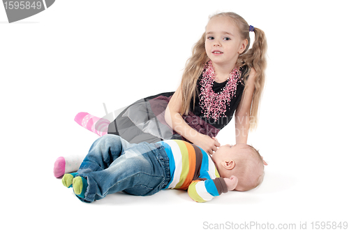 Image of Newborn baby with sister
