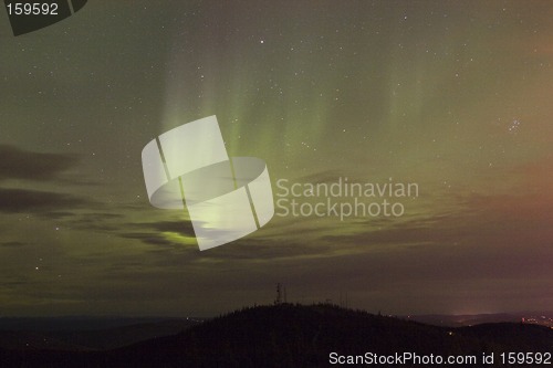 Image of Vivid aurora borealis through clouds