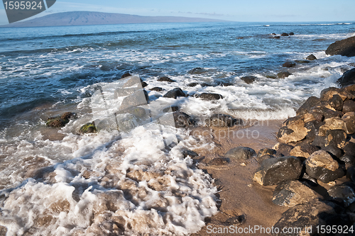 Image of Rocks, and Pacific ocean waves on the island of Maui