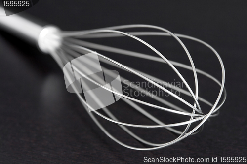 Image of Wire whisk on dark background