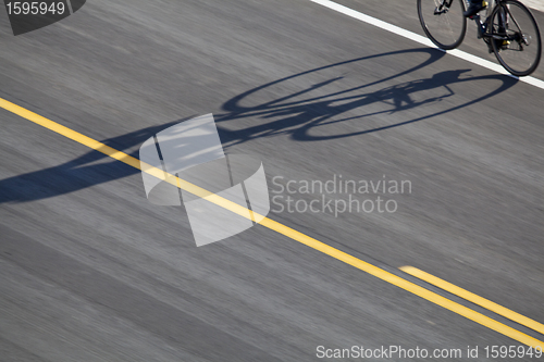 Image of bike, road and shadow