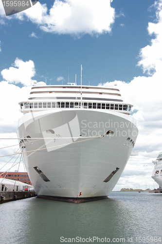 Image of front of a cruise ship docked at a port in Norway