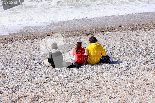 Image of three children on the beach