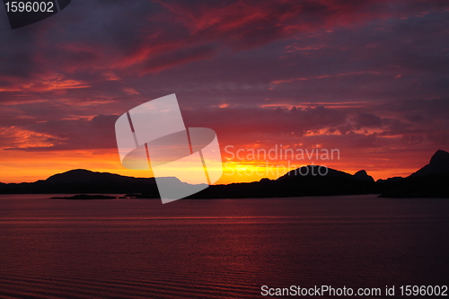 Image of sunset view from a boat off the coast of norway